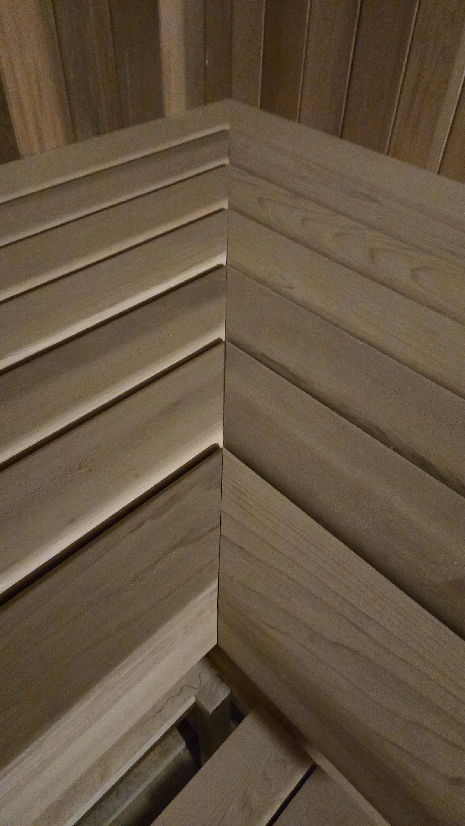 Close detail of precisely fitted sauna timber benches